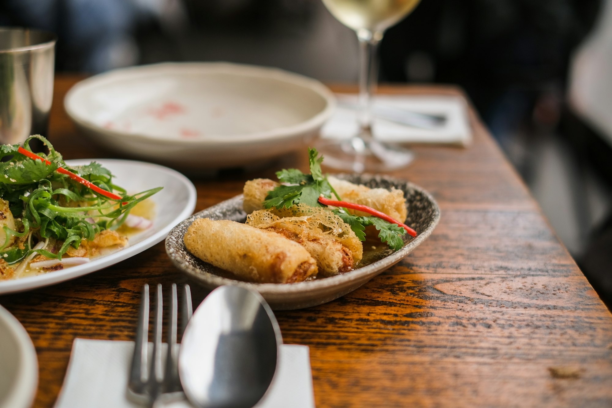A shared table of Indo-Chinese dishes at The Monk